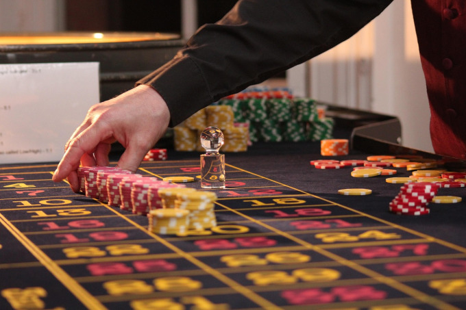 Live roulette table with real dealer and casino chips for Evolution Gaming online roulette