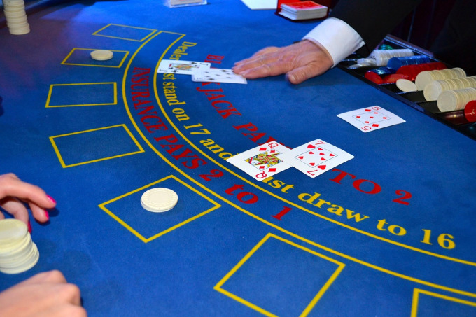 Live baccarat table with dealer and playing cards for online baccarat in Southeast Asia