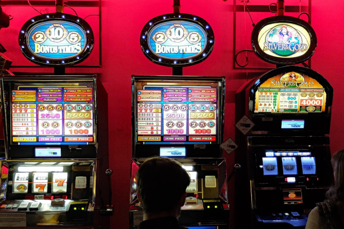 Row of online slot machines representing casino slots available to Evolution Gaming players